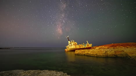 milky way time lapse near pegeia, cyprus on the rocky shore