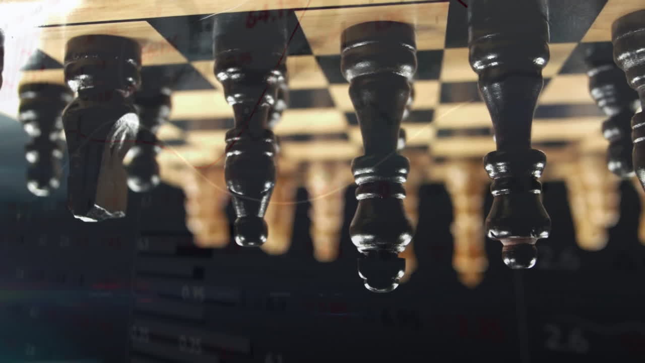 Dark wooden chess pieces displaying glossy highlights on board, creating shallow depth of field