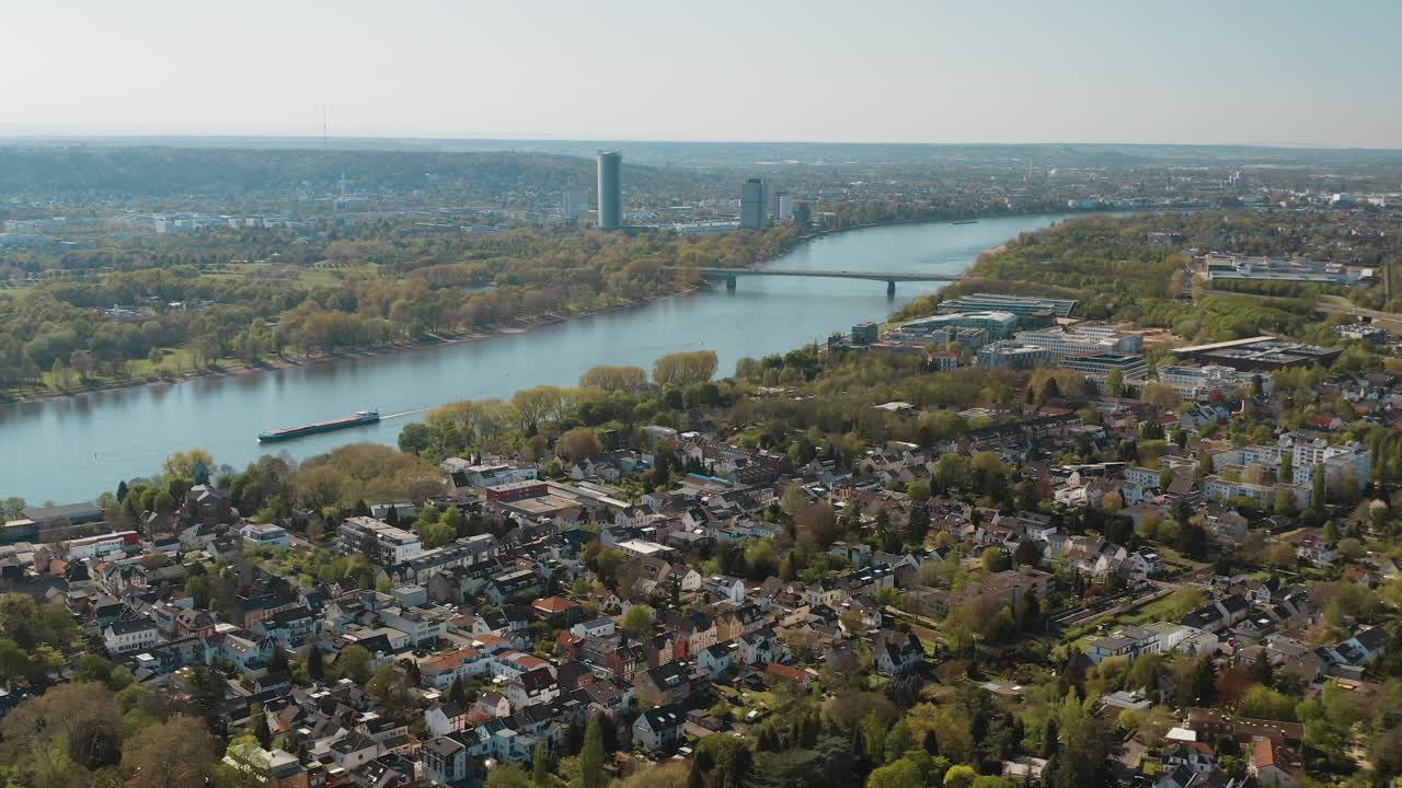 Drone - Aerial panorama shot bonn with the konrad adenauer bridge, the river rhine with a ship, the Kameha Grand hotel and the post tower 30p