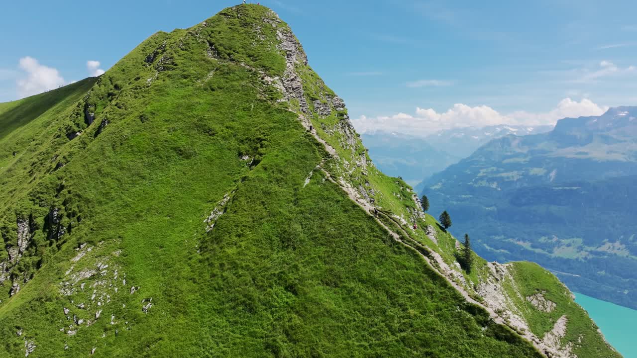 Drone rises to reveal breathtaking views of trail, Switzerland's mountain gem