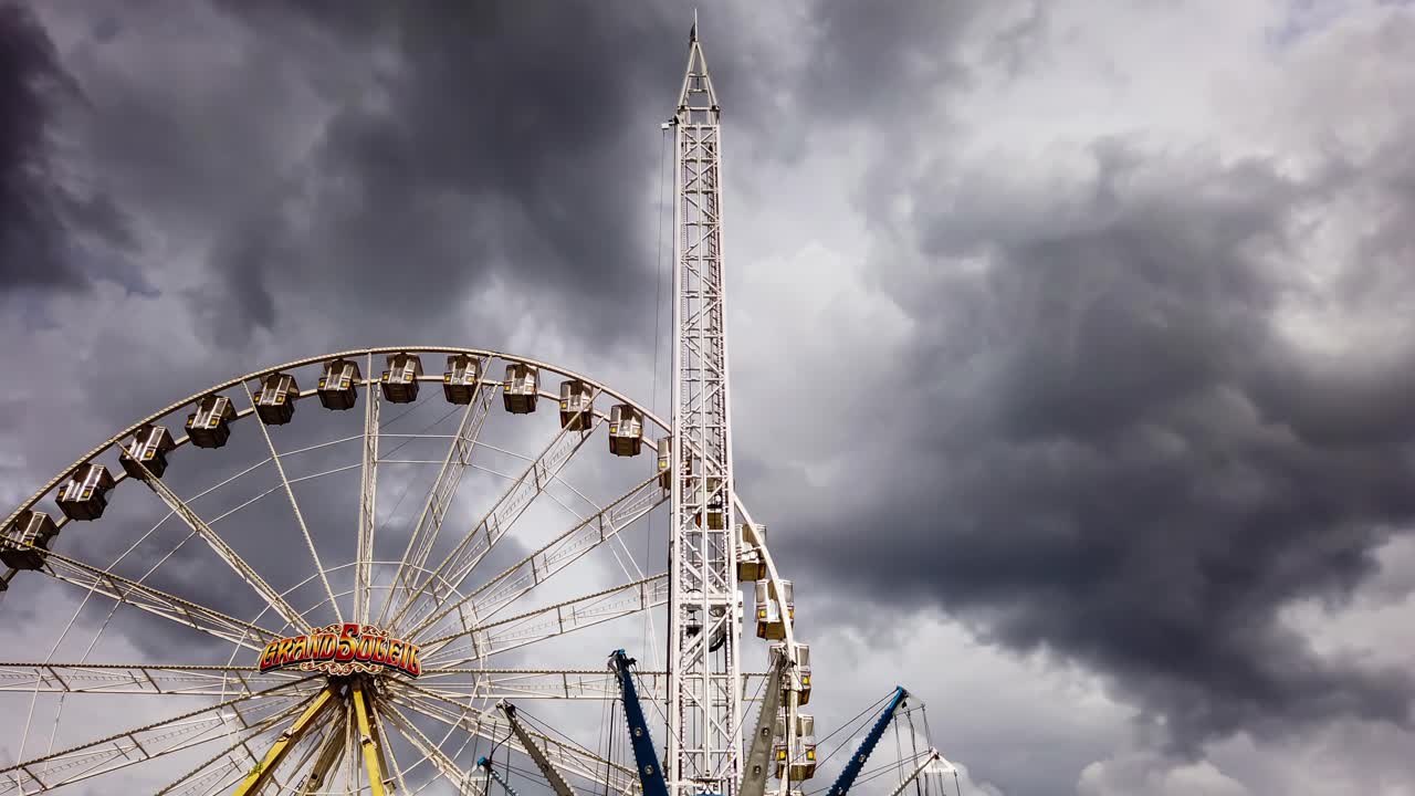 Motion Time-lapse at Amusement Park With Weather Shifting From Sunny to Overcast