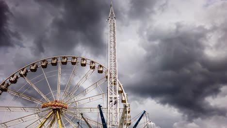 motion time-lapse at amusement park with weather shifting from sunny to overcast