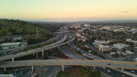 high aerial view of heavy traffic flow on freeway highway overpass, walnut creek