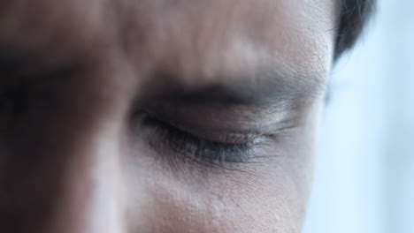 close-up of a man's face with tired eyes