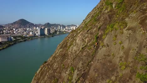 Rock-cimbing-by-the-ocean-drone-clip