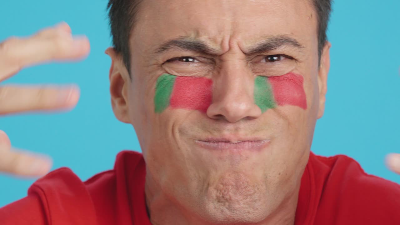 Man with portuguese national flag upset with a referee