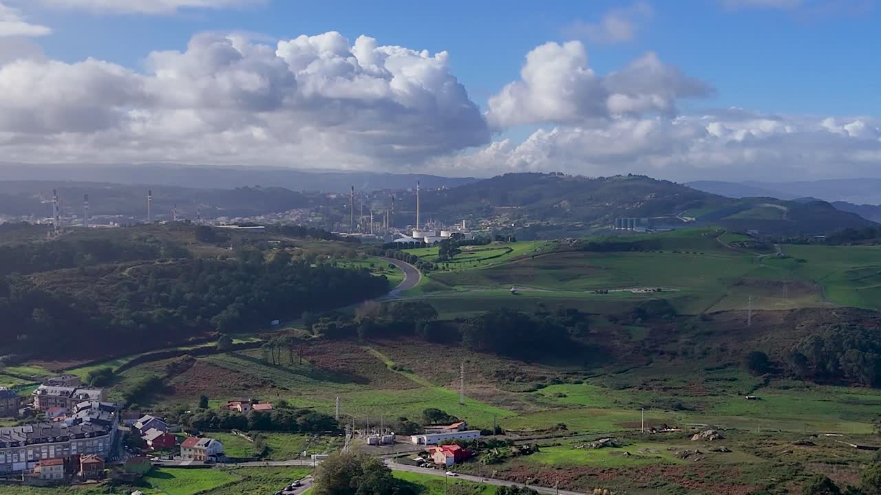 Park de Bens in La Coruña with Hitchock visual effect on the mountain. Reference industrial zone in the background.