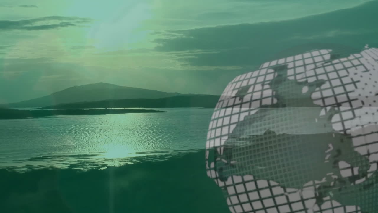 Digital globe animation over serene lake and mountain landscape at sunset