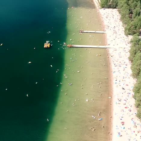 Flying-Over-Crowed-Beach-in-Summer-in-Finland