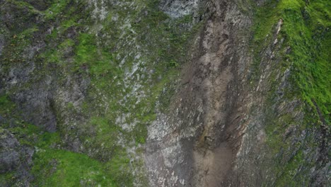 Aerial-view-of-landslide-blocking-highway-through-steep-hills-in-Lima,-Peru