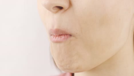 woman eating dried peach close-up. dry fruits.