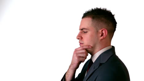 businessman thinking with hand on chin