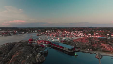 drone flies over swedish archipelago at sunset in skarhamn