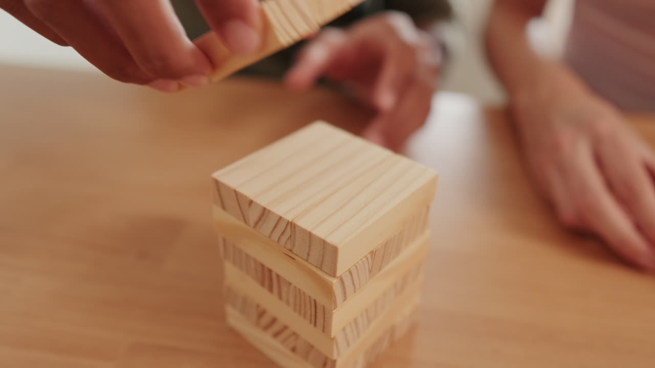 Couple Playing Jenga at Home