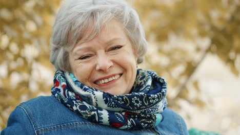 smiling senior woman outdoors