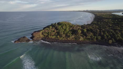 scenic fingal headland and beach in new south wales, australia - aerial drone shot