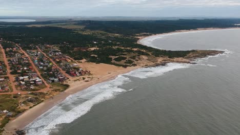 A-village-clustered-on-the-beach-of-the-ocean-in-Rocha,-Uruguay