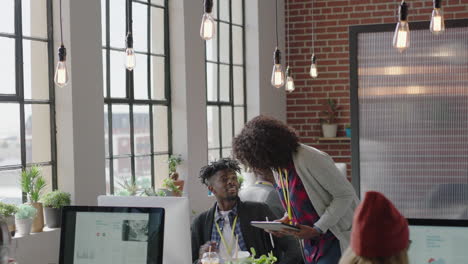 young business people working in startup office african american team leader woman pointing at computer screen showing colleague creative ideas training intern brainstorming discussing information