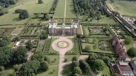 aerial view orbiting hatfield house majestic tudor mansion, parkland and glorious landscaped gardens