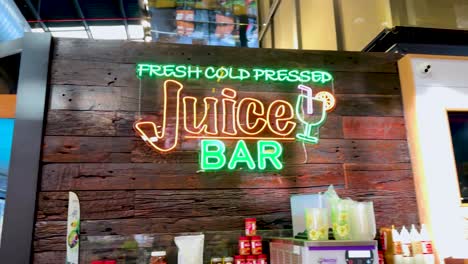 bright neon sign at a juice bar