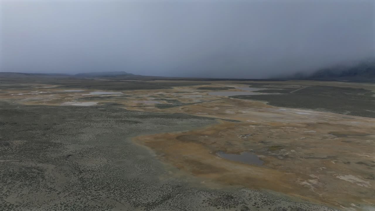 Long Valley Caldera Mammoth Lakes Convict Canyon Minarets Sierra Nevada mountains Hilltop Wild Willy's Hot Springs California aerial drone Benton Crossing winter sunset fog forward motion