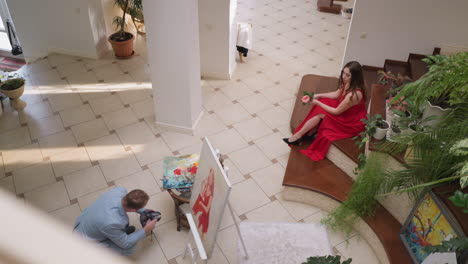 a woman in a red dress posing for a photo shoot