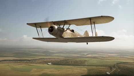 vintage biplane flying over countryside