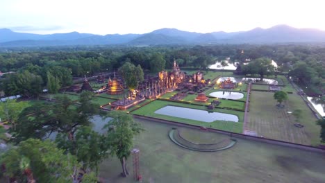 AERIAL-SHOT-OF-SUKHOTHAI-HISTORICAL-PARK-UNESCO-WORLD-HERITAGE-SITE-IN-THAILAND-AT-SUHKOTHAI-PROVINCE,-THAILAND-SHOT-ON-DJI-PT4