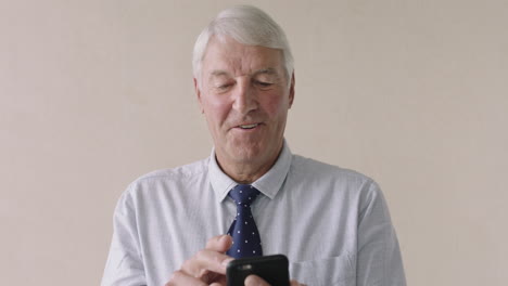 close-up-of-senior-businessman-using-smartphone-portrait-of-professional-entrepreneur