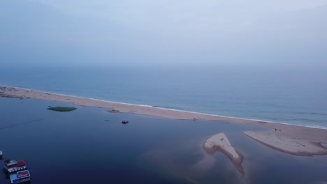 Beautiful-calm-waves-by-the-beach-of-Isola-Di-Cocco-in-India---aerial