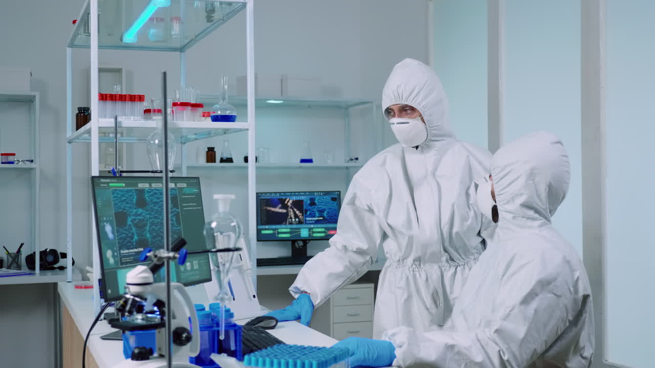 Biotechnology scientist wearing ppe suit researching