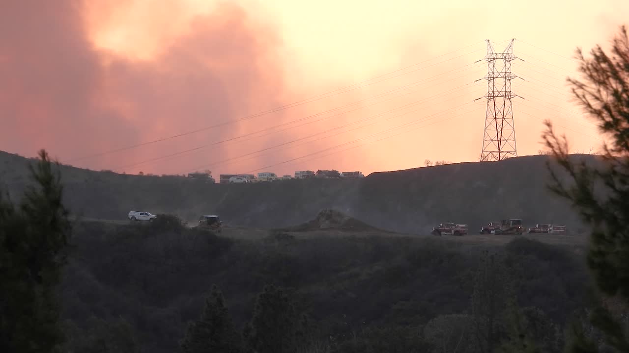 diggers moving to help reduce the spread of the blaze at the Los Angeles wildfire