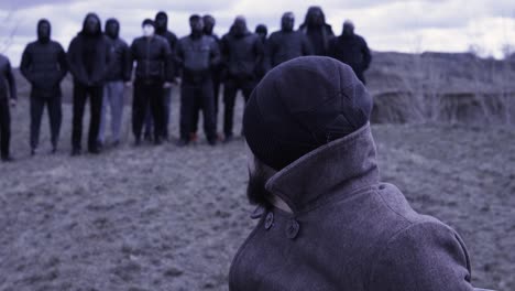 people in masks standing outdoors