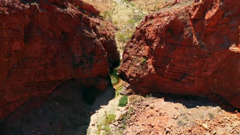 red-colored cliff of the simpsons gap at the wilderness in west macdonnell ranges in australia