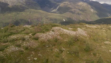 Drone-shot-of-Norway-remote-rocky-landscape-with-lakes,-forests-and-rivers