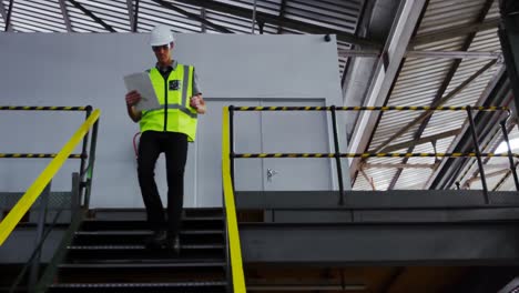 male engineer maintaining stocks in workshop 4k