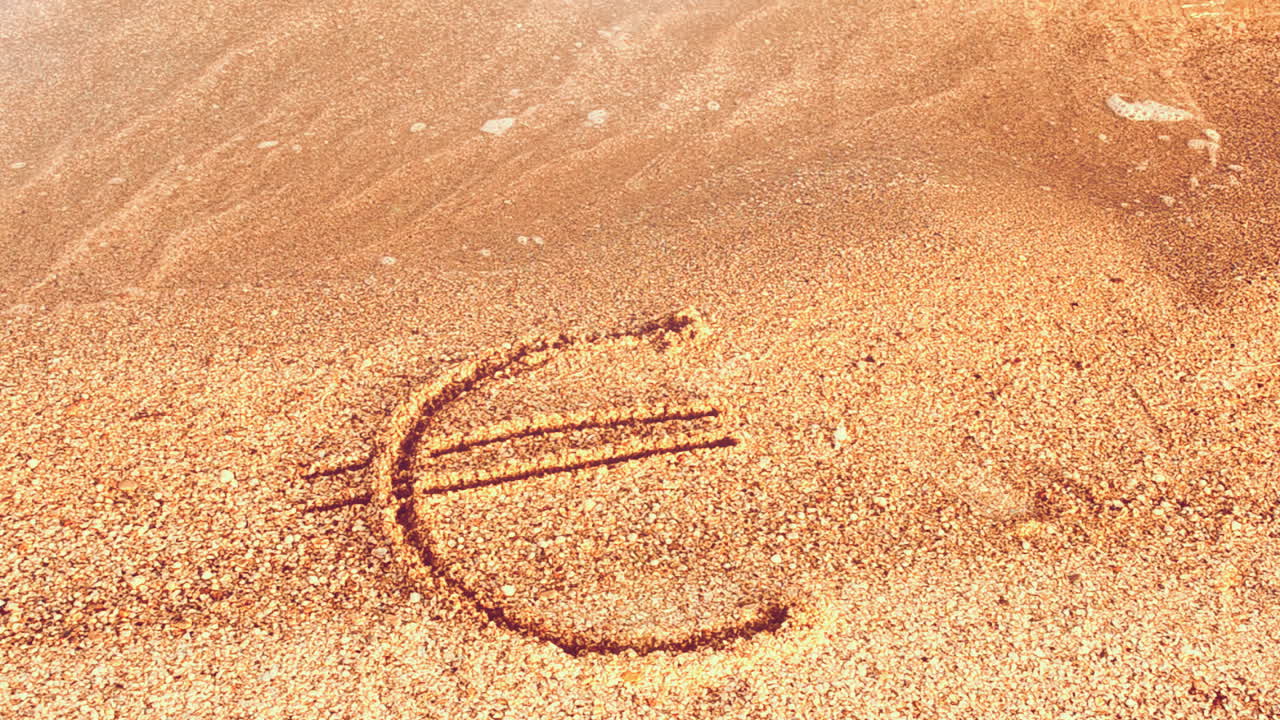 Sand og valuta. Eurotegn på sand