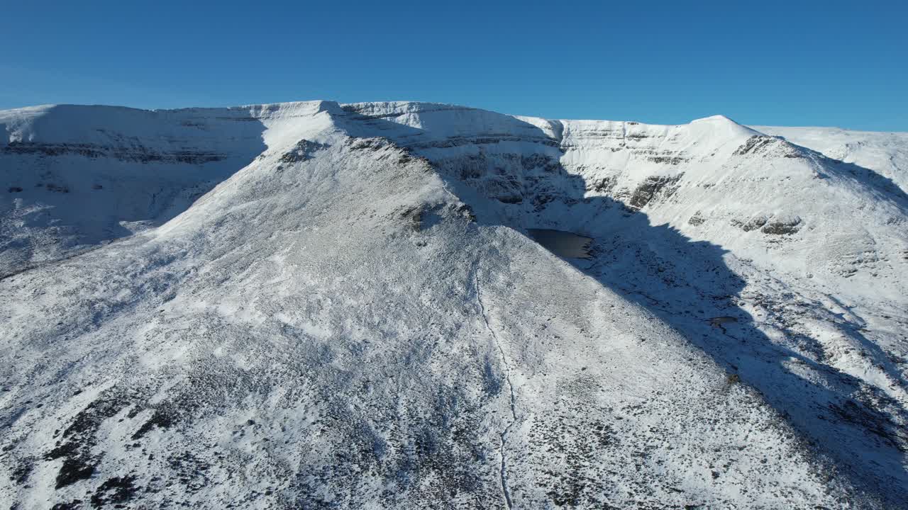Ireland Mountains drone flying right revealing Coumshingaun lake pearl of the Comeragh mountain Range Waterford Ireland epic Locations and landscapes in winter
