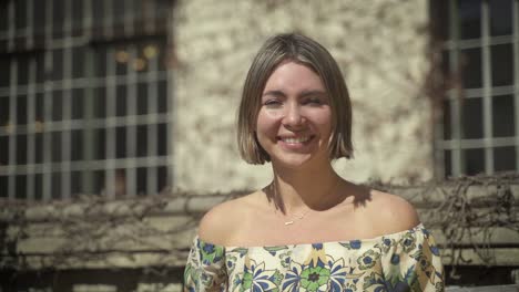 A-handheld-closeup-footage-of-a-surprised-woman-as-she-covers-her-mouth-with-both-of-her-hands-while-looking-at-the-camera