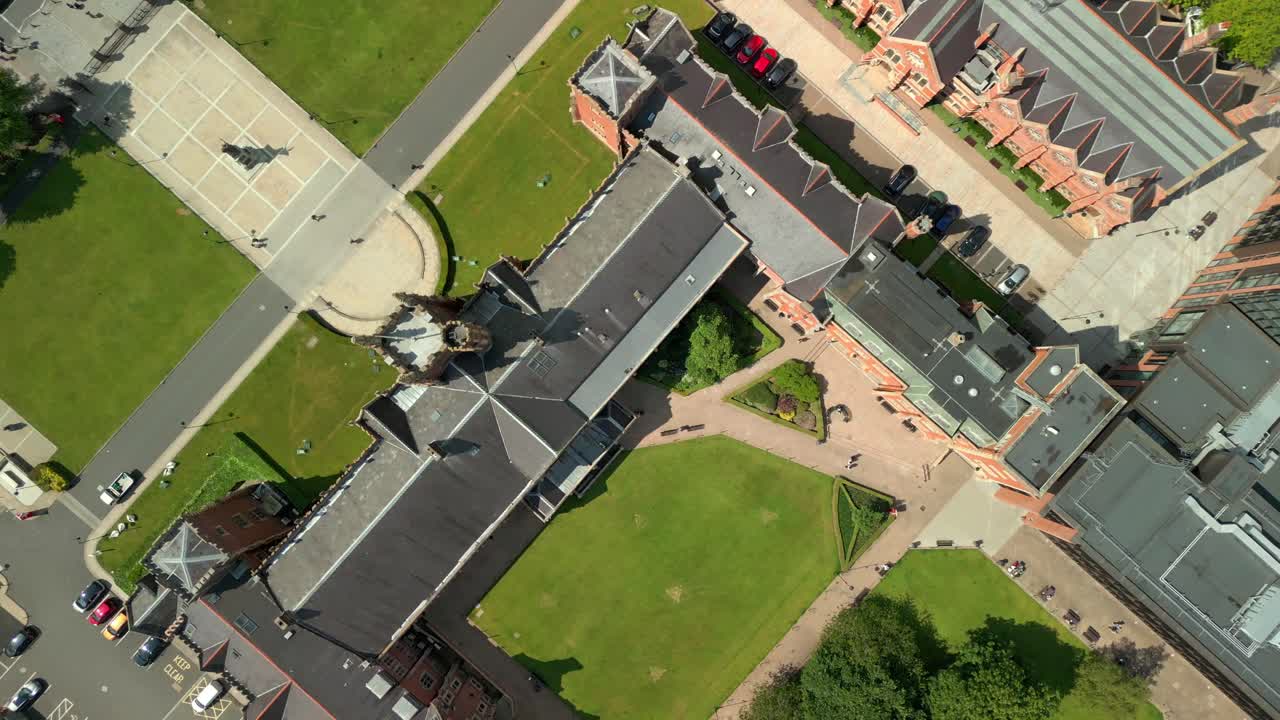 Overhead aerial video of Queen's University Belfast, and the surroundign campus, in Northern Ireland, UK on a bright and sunny day. Produced at 4K resolution, 60FPS and with Rec709 color.