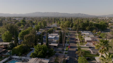 los angeles california suburb near downtown, view of mountains behind, aerial dolly