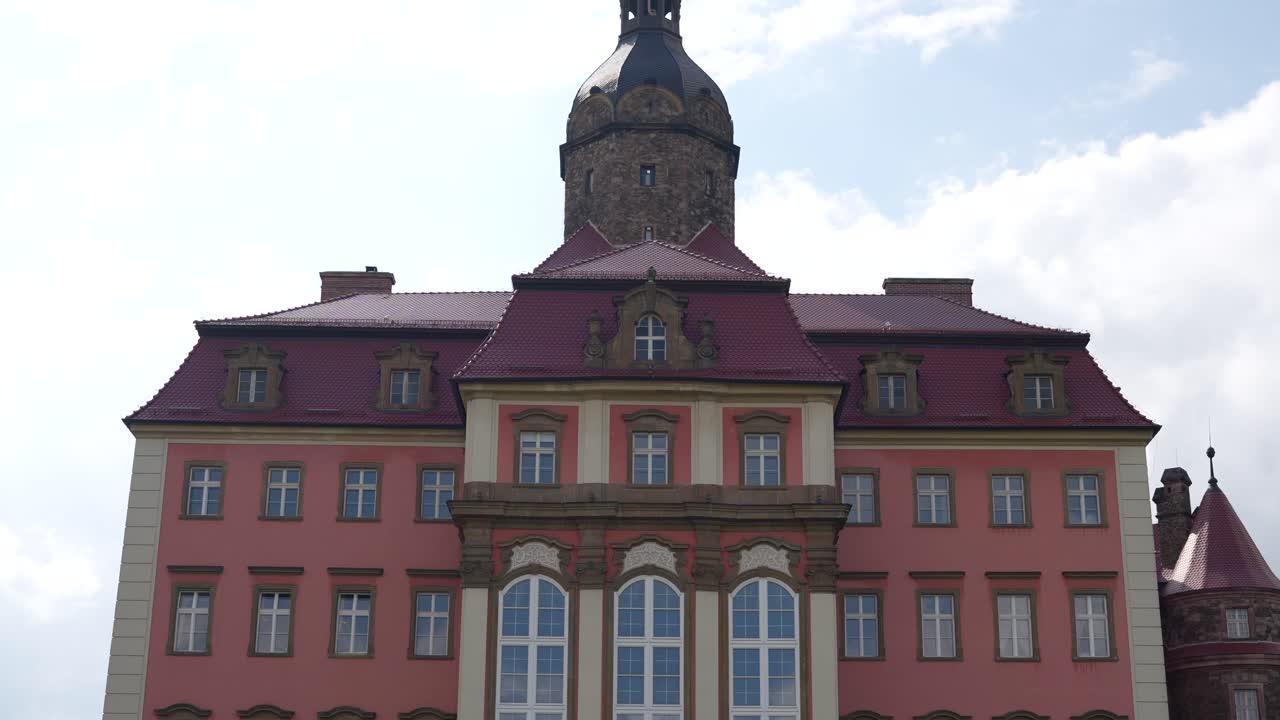 Grand pink facade of Ksiaz Castle. Historic fortress and famous landmark in Poland