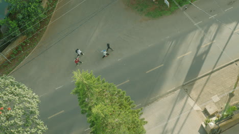 Beautiful-static-shot-from-above-of-a-busy-street-with-pedestrians-and-cars-in-Nairobi,-Kenya,-Africa