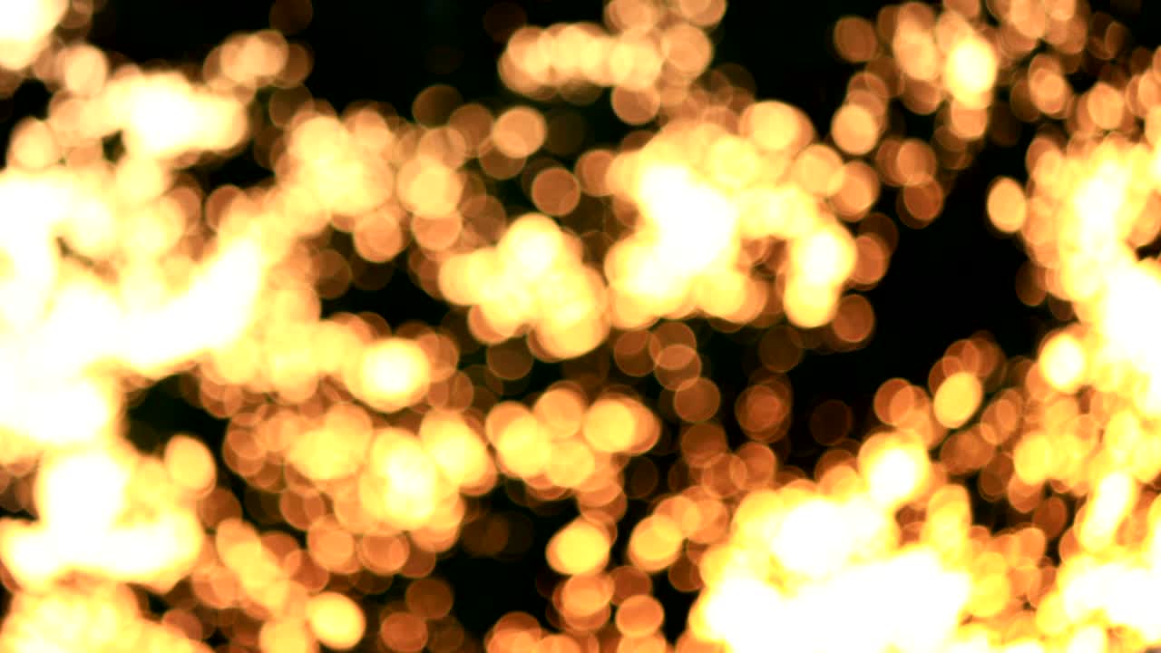 oro amarillo naranja brillante parpadeante brillante circular bokeh luz fondo abstracto 4k