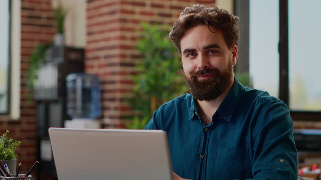 Portrait of company worker planning project report with charts