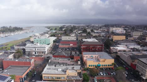 Aerial wide rising shot of charming historic buildings in old town Eureka, California. 4K