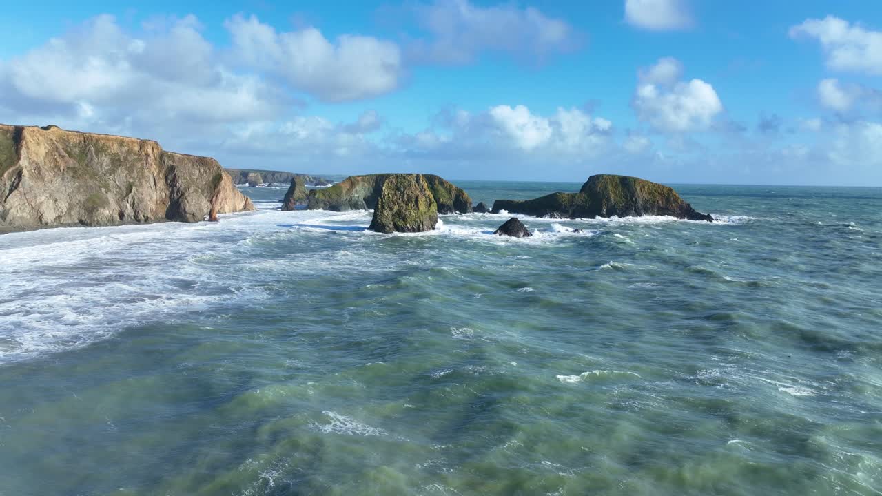 Wild Ireland drone seas flying to sea stacks in winter storm Copper Coast Waterford