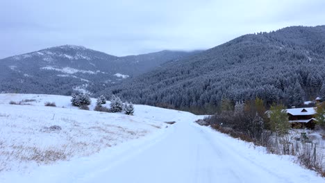 Montana-Snowy-Road-Leading-to-Forest-in-Bozeman-4K