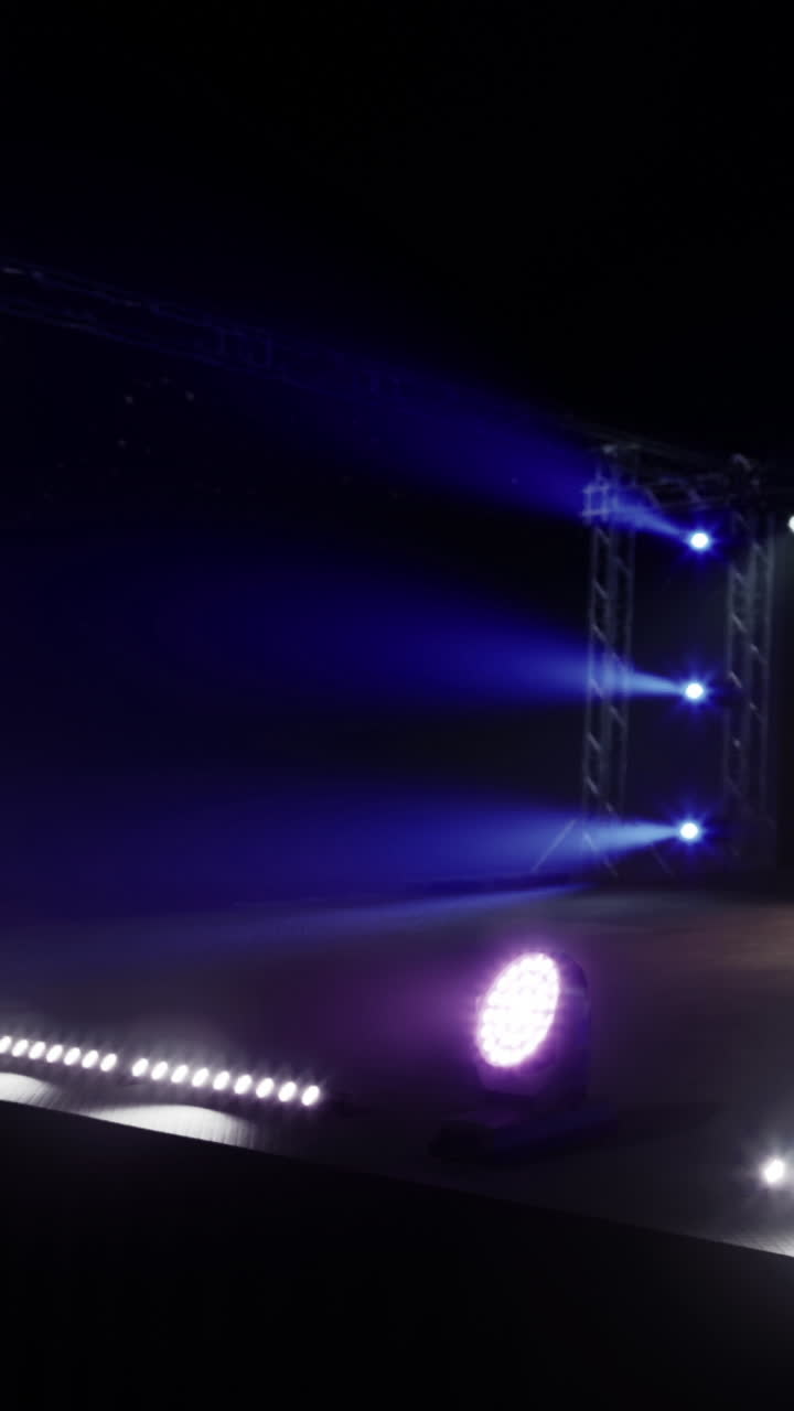 Stage setup for a music event with colorful lights and equipment