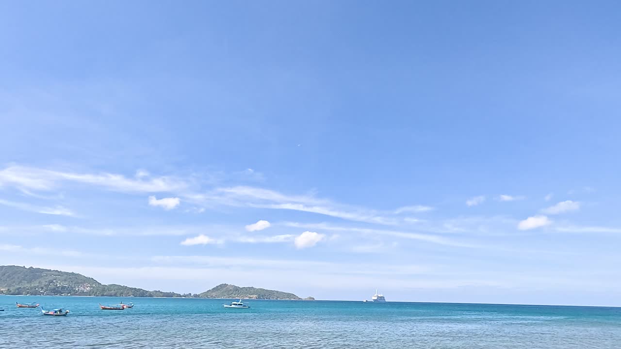 A tranquil seaside scene with rocky shores and calm blue waters under a clear sky, captured in Port Campbell, Australia